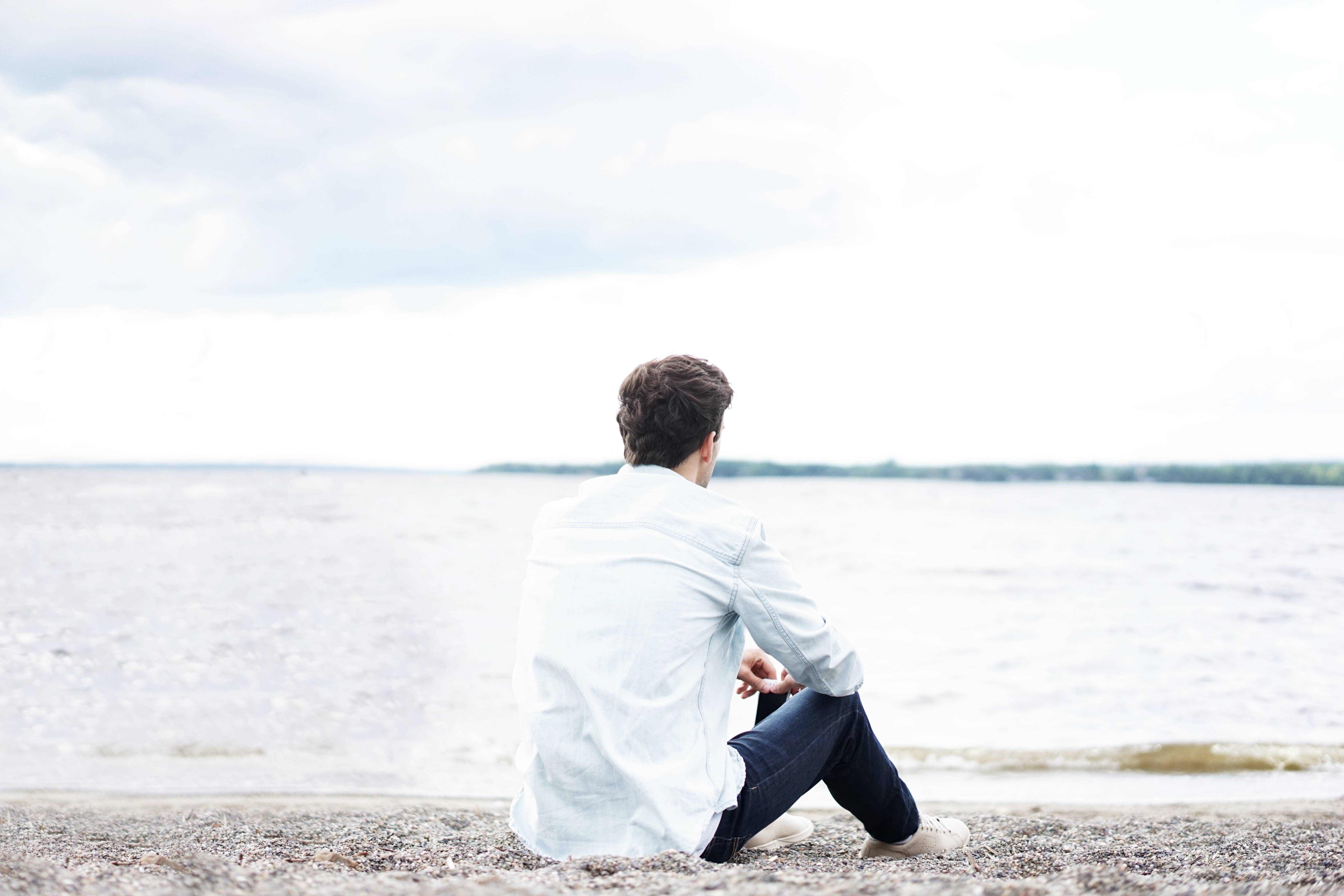 Man sat on a beach