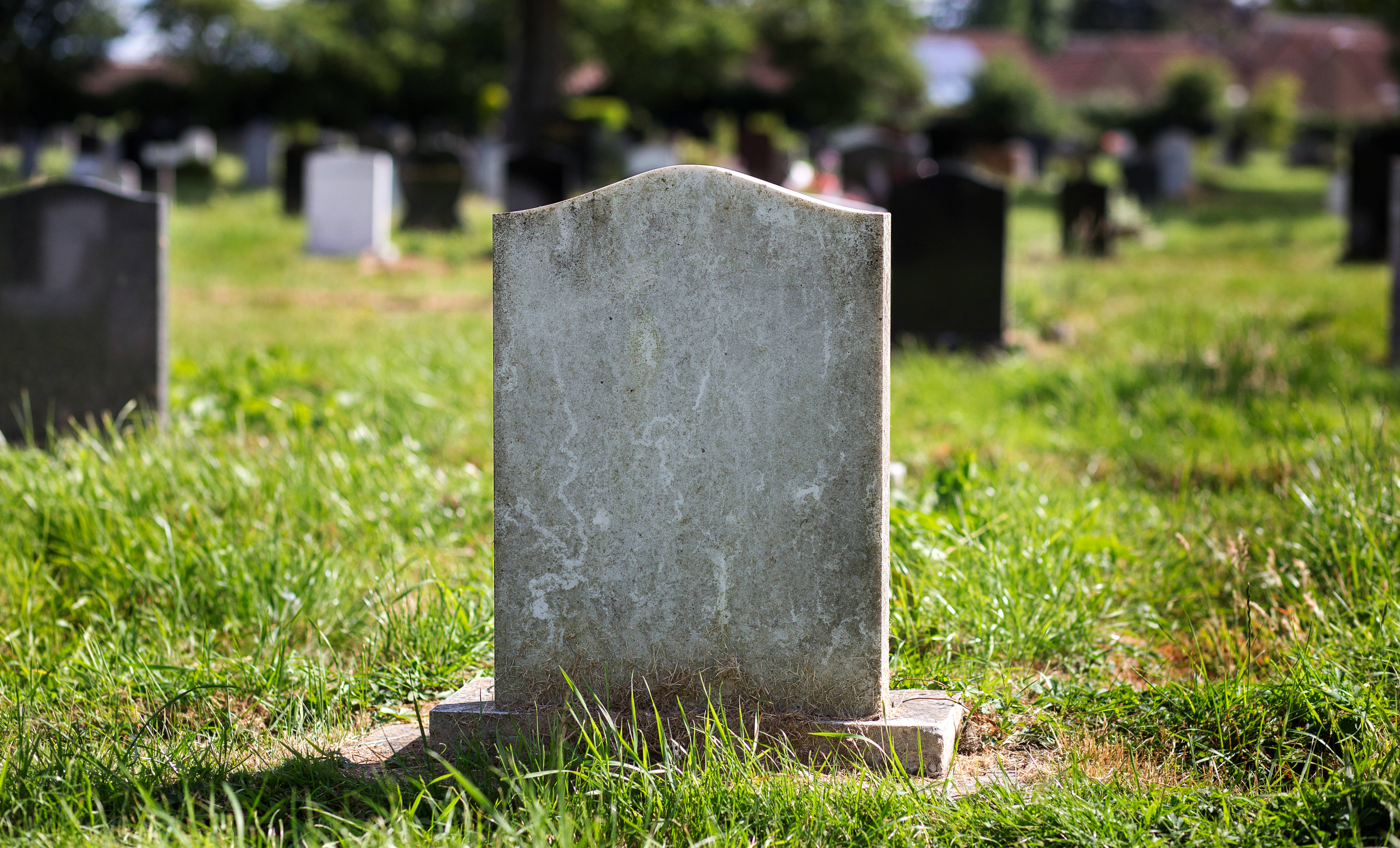 Blank gravestone in graveyard