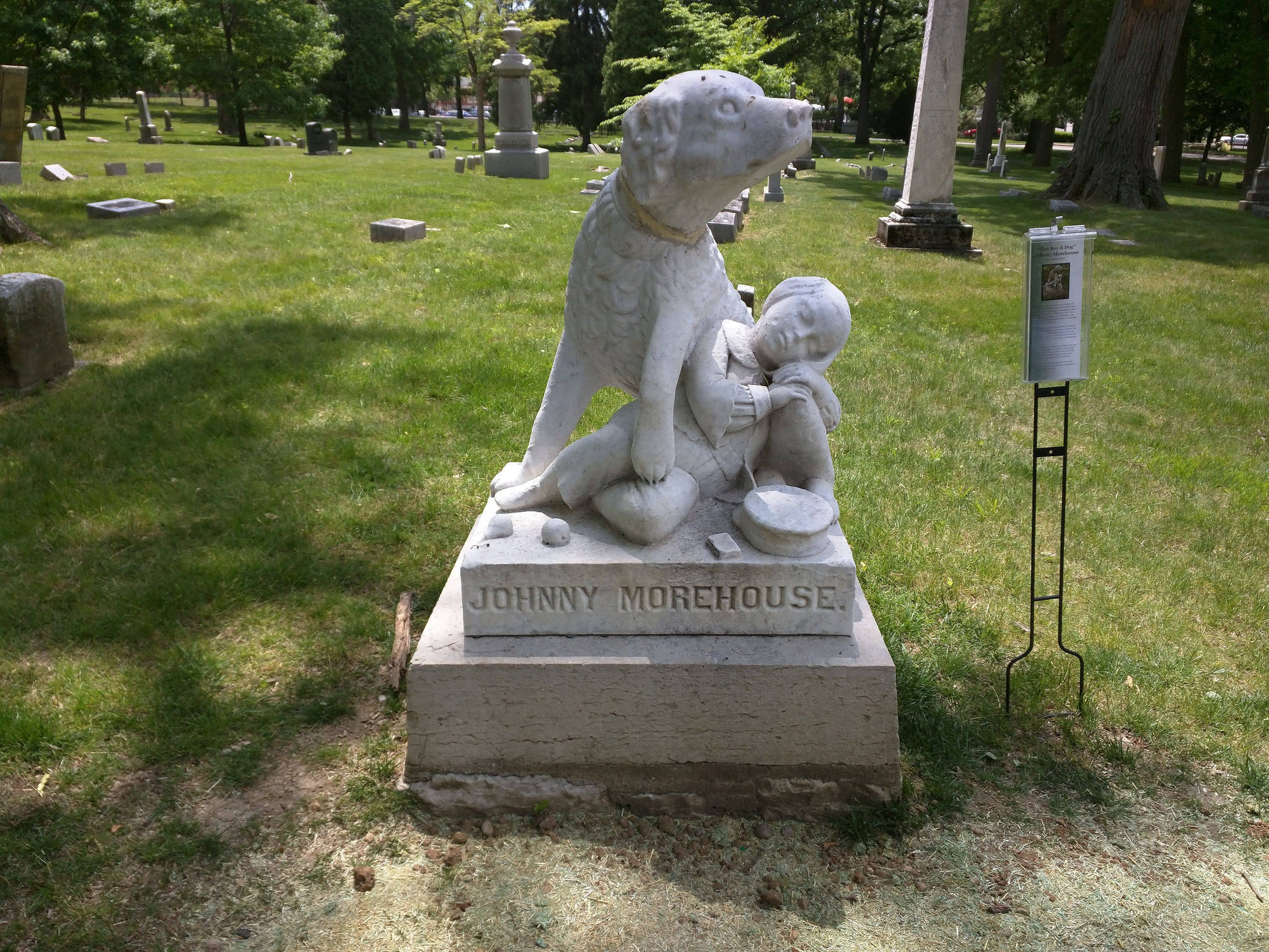 carved dog on headstone