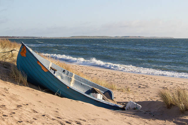 Old wooden boat on beach
