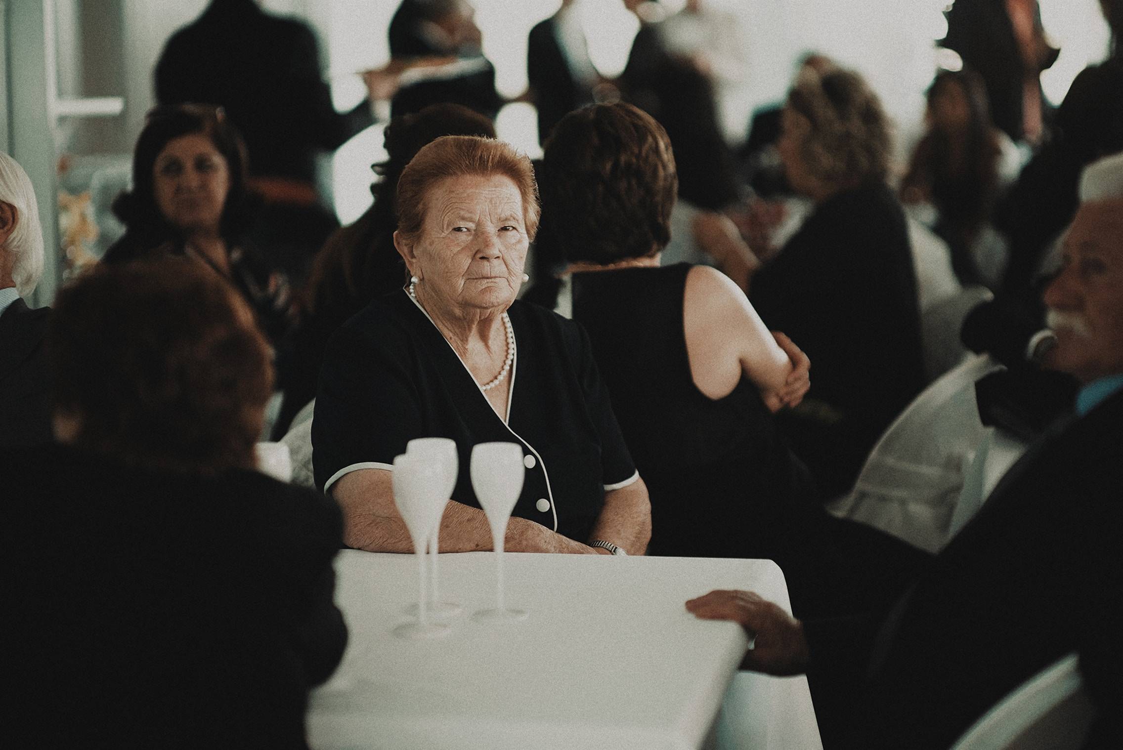 Group of people wearing black at a funeral