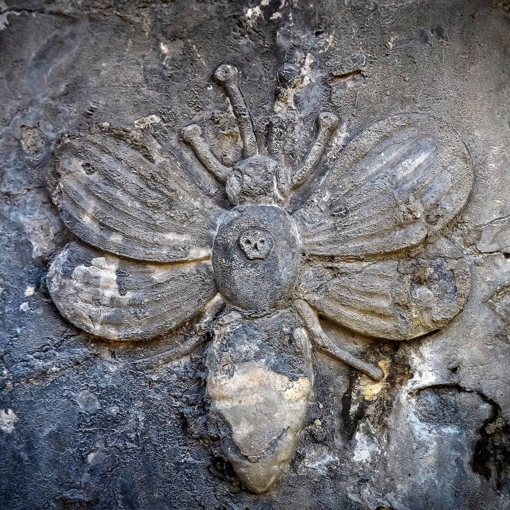 carved bee on headstone