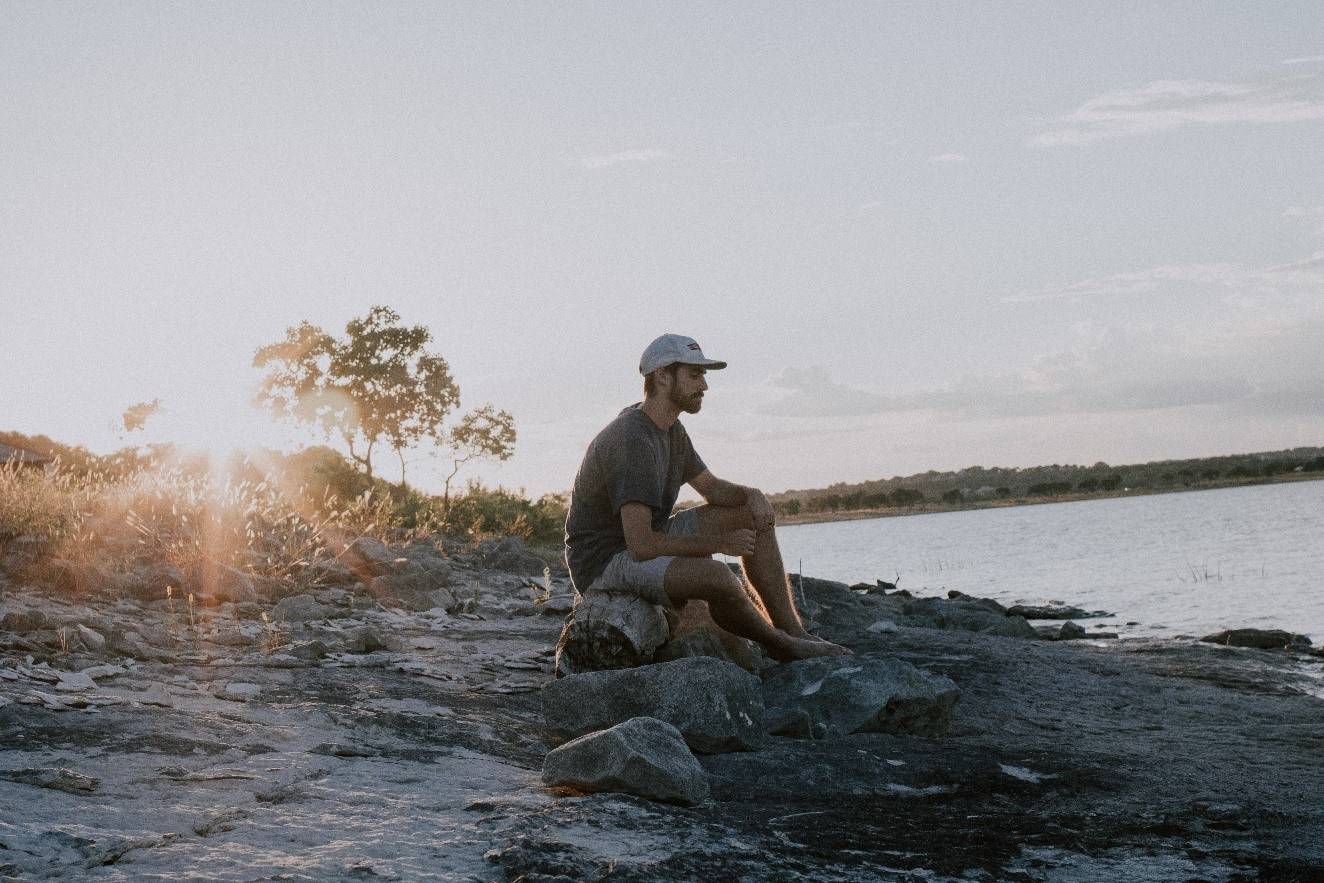 Man sitting by the sea