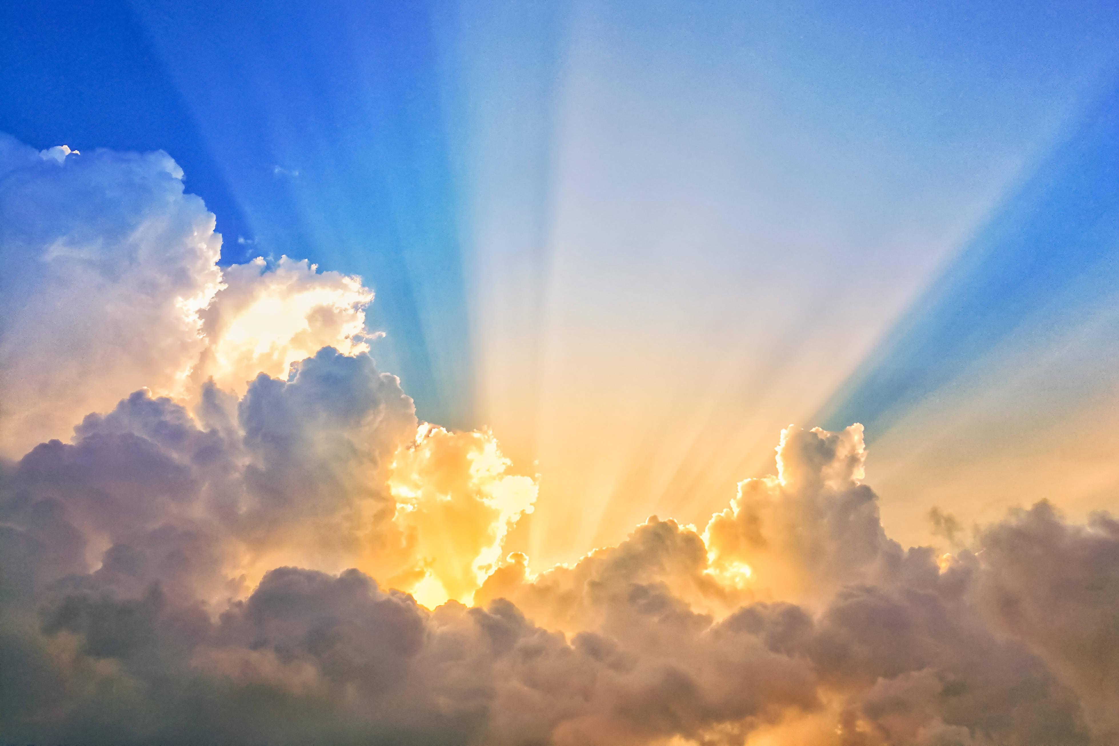 Sun beams shining through the clouds