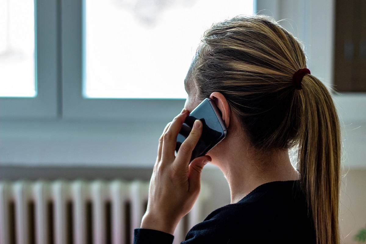 Grieving woman on the phone