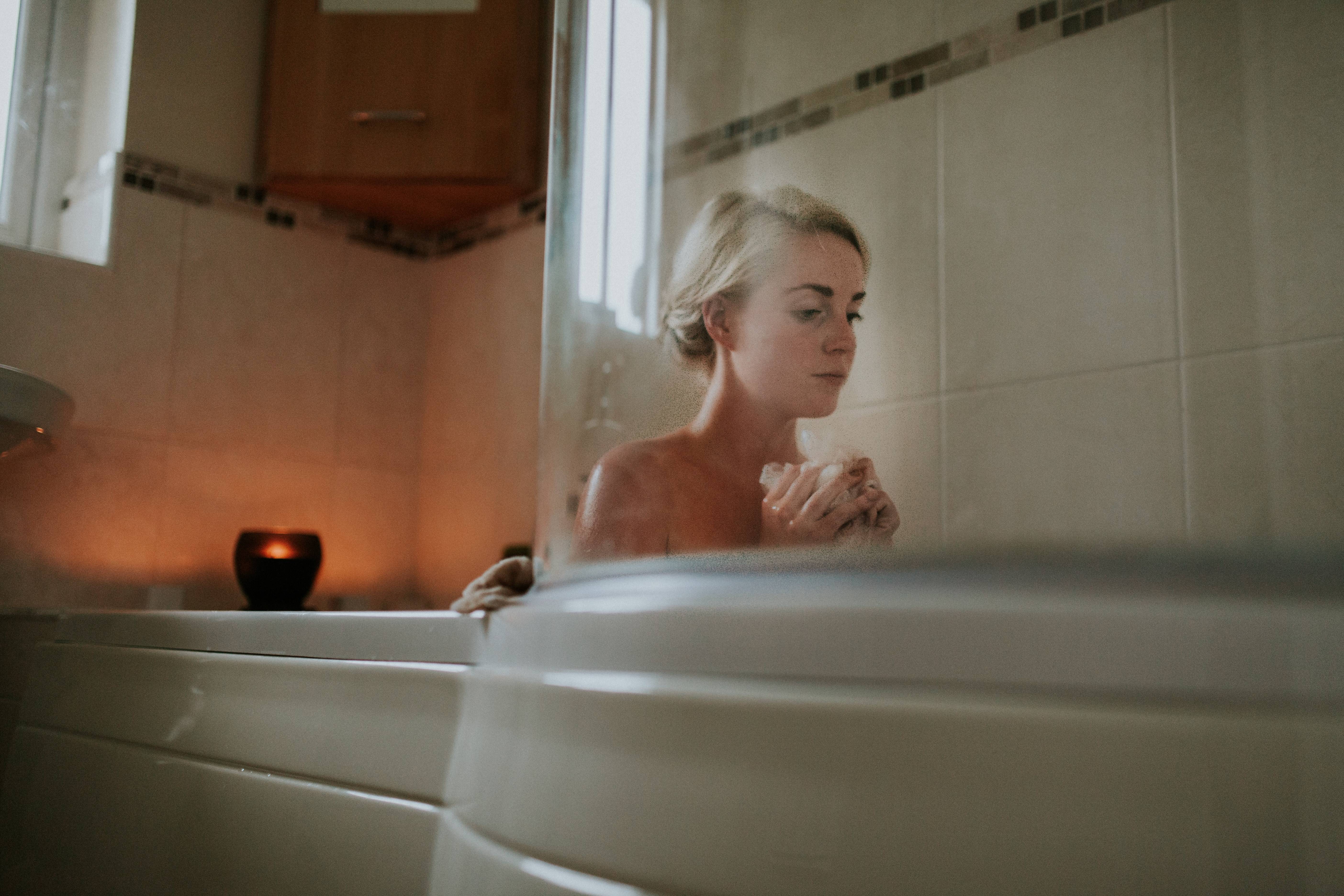 Woman sitting in a bath