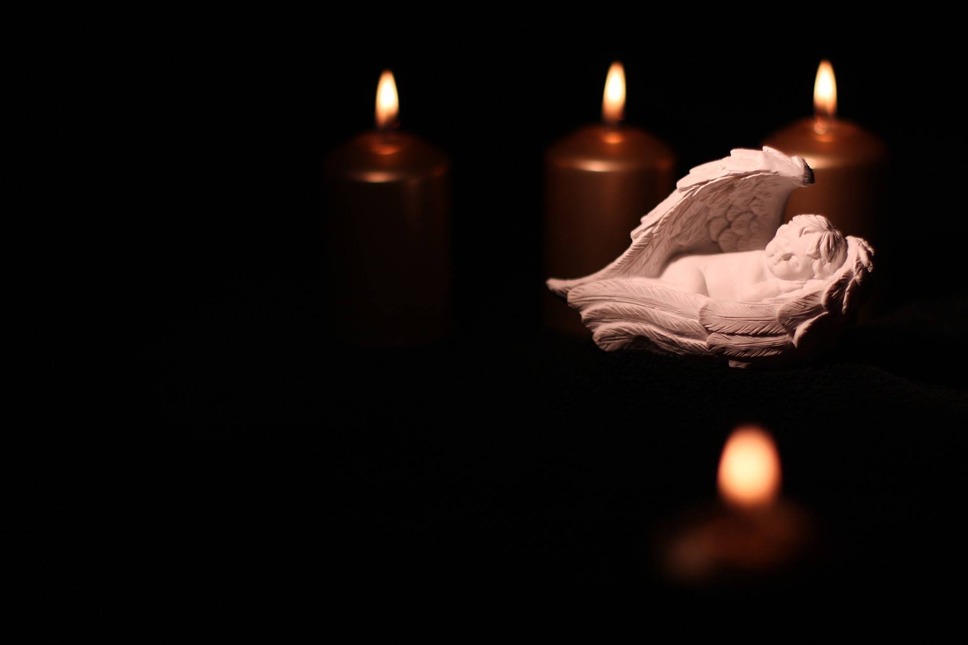 Candles and an angel statue