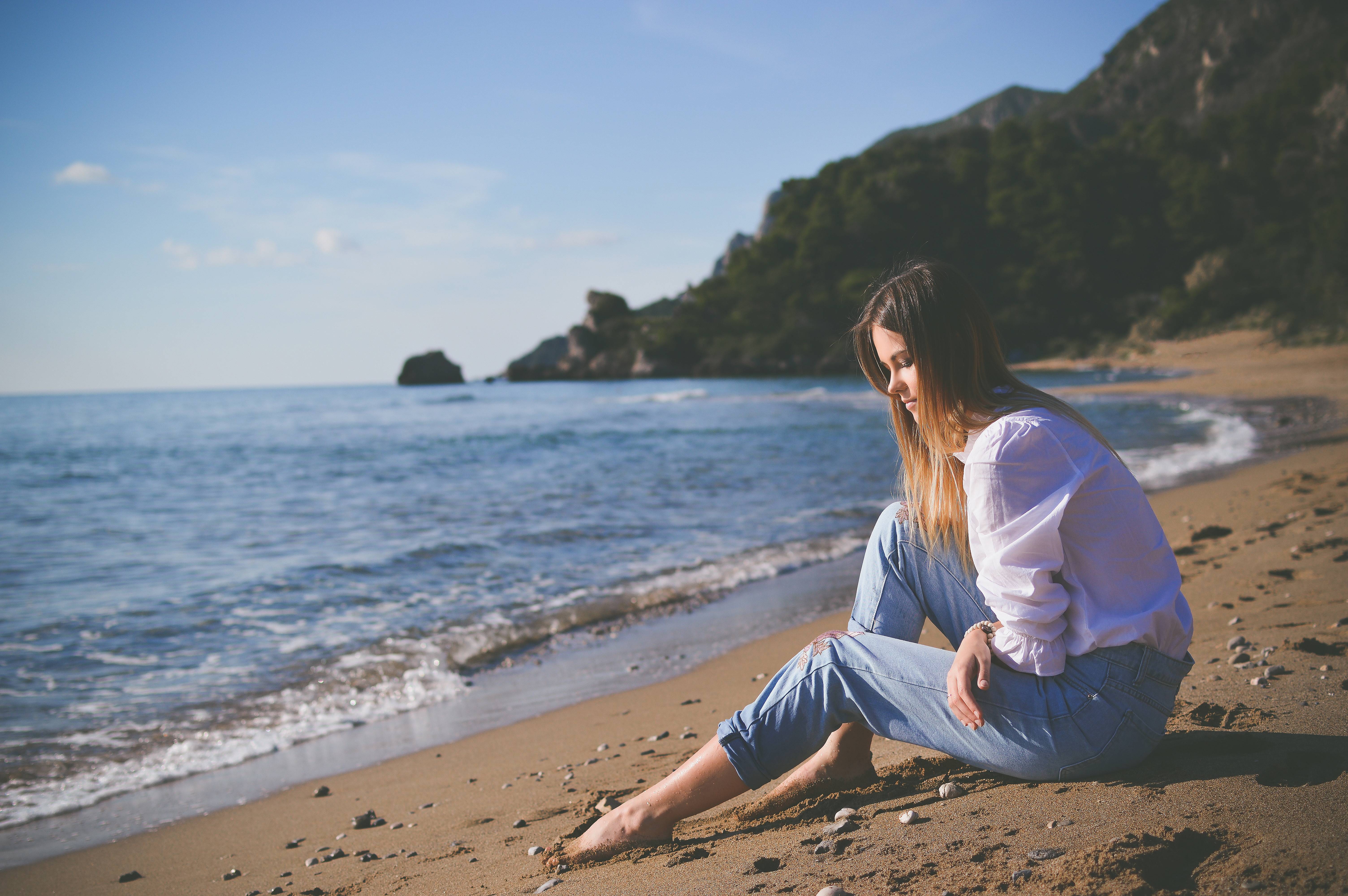 Woman sitting on the beach