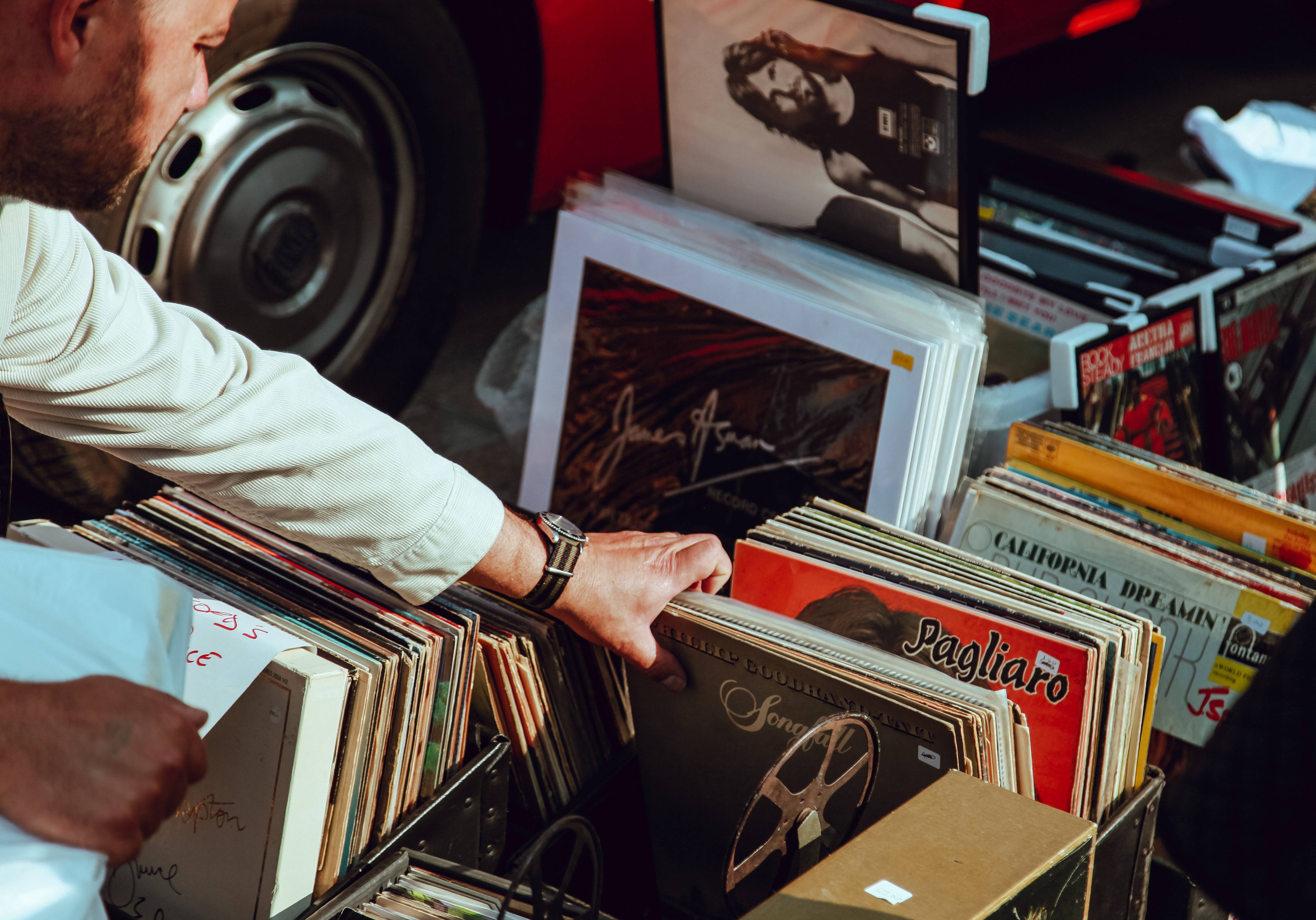 Man going through record collection