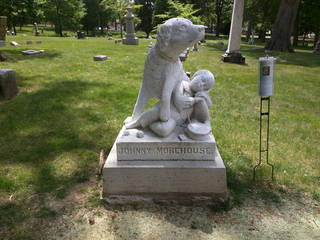 carved dog grave marker
