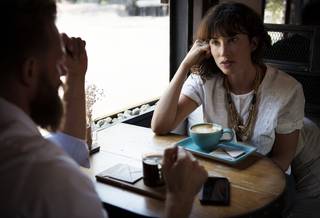 man and woman having coffee