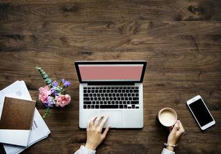 Woman typing on a laptop