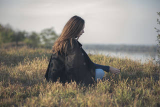 Lady grieving in a field