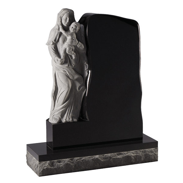 Carved Angel Sitting On Headstone